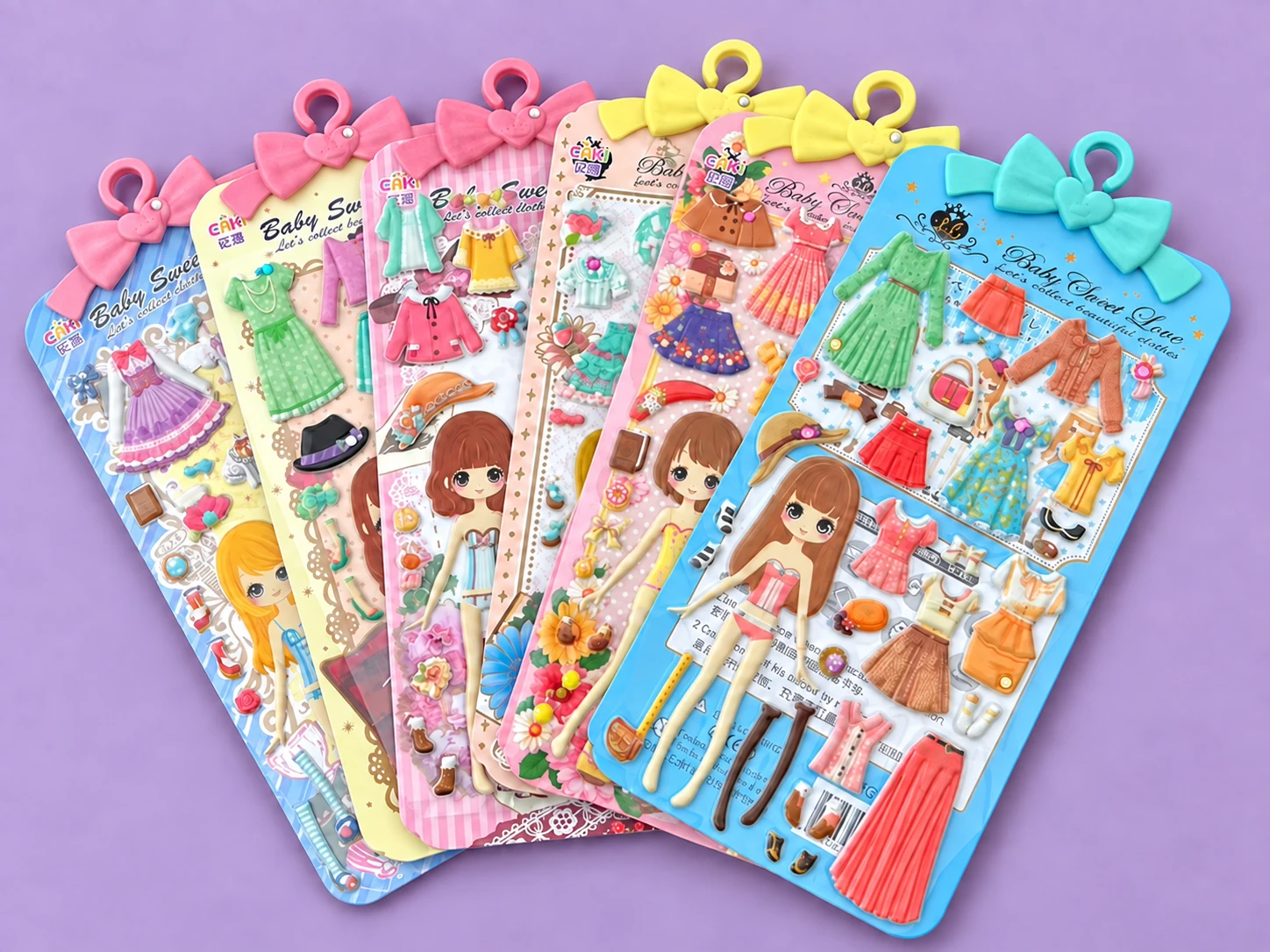 Dress-up doll puffy sticker sets with colorful outfits and accessories