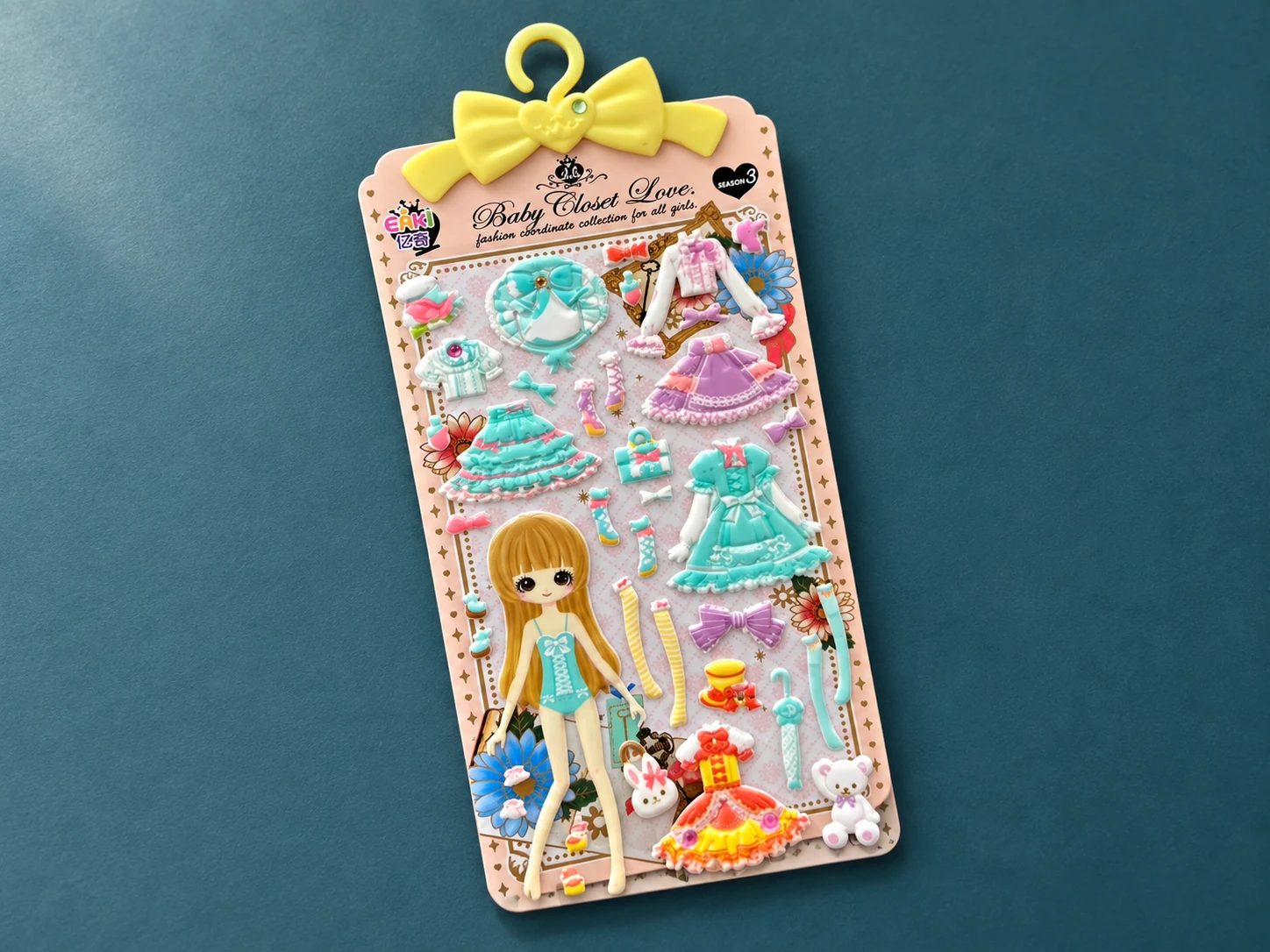 Dress-up doll puffy sticker sheet with dresses, shoes and accessories