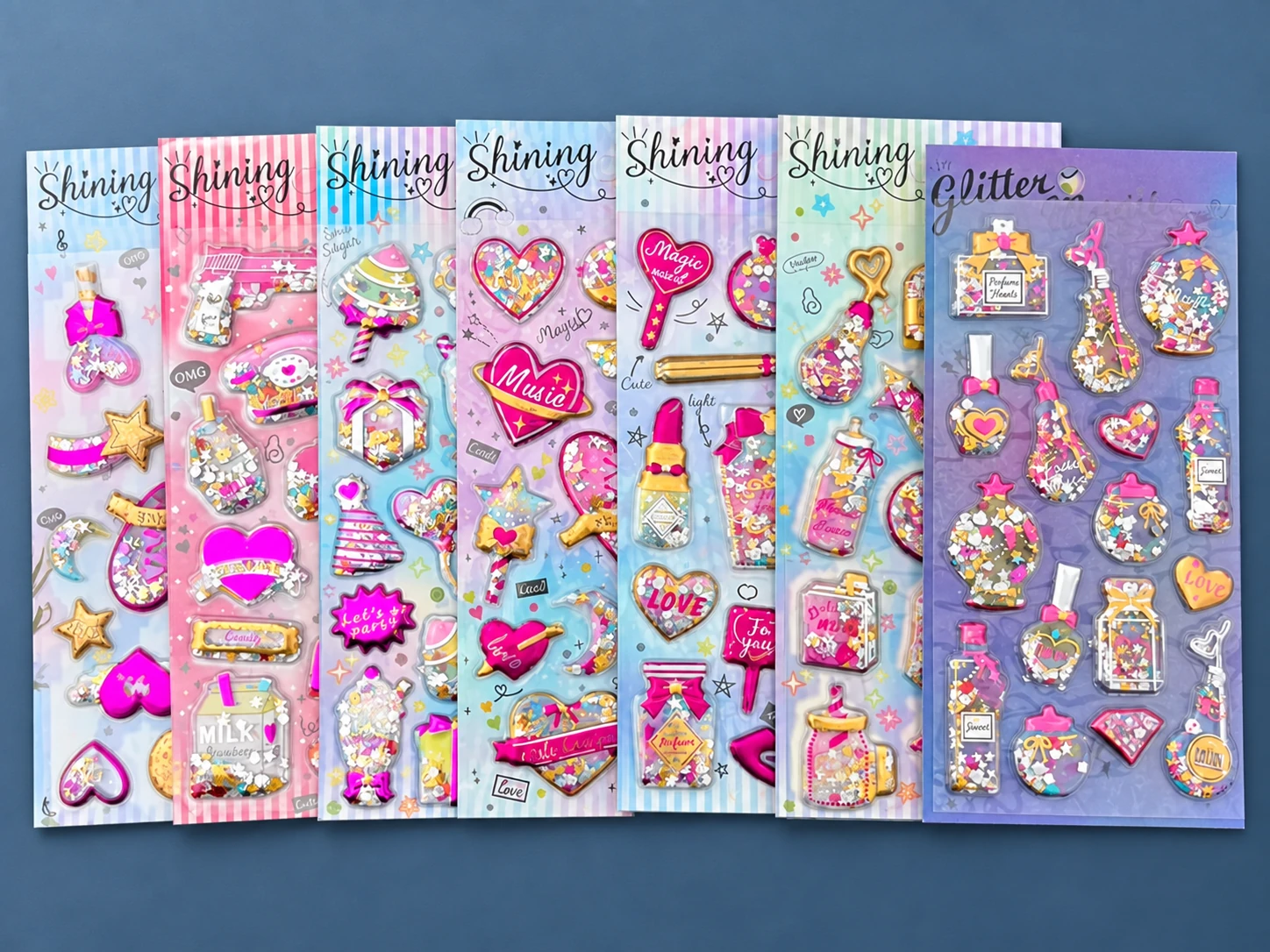Assorted glitter puffy sticker sheets with hearts, perfume bottles and accessories