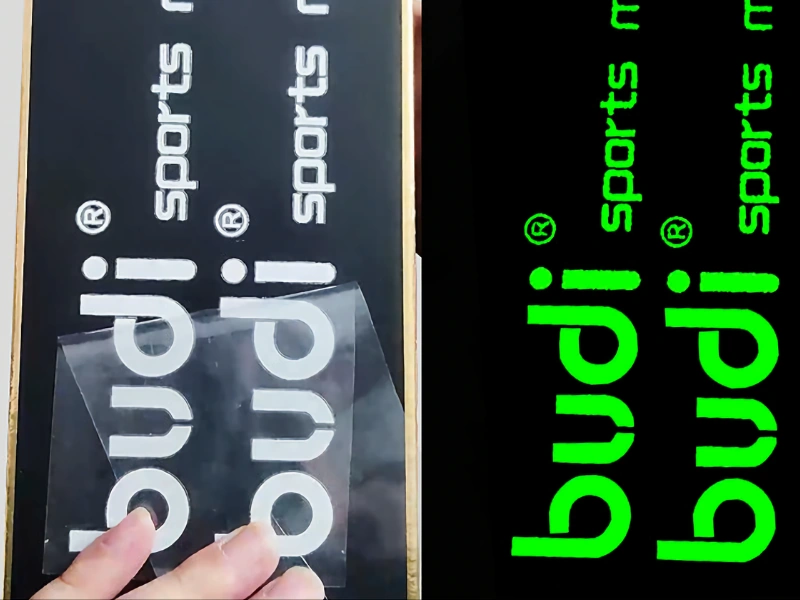 Custom glow-in-the-dark decals and vinyl lettering on transfer tape in day and night views