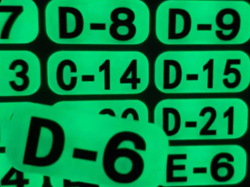 Custom glow-in-the-dark rectangular number labels with green afterglow