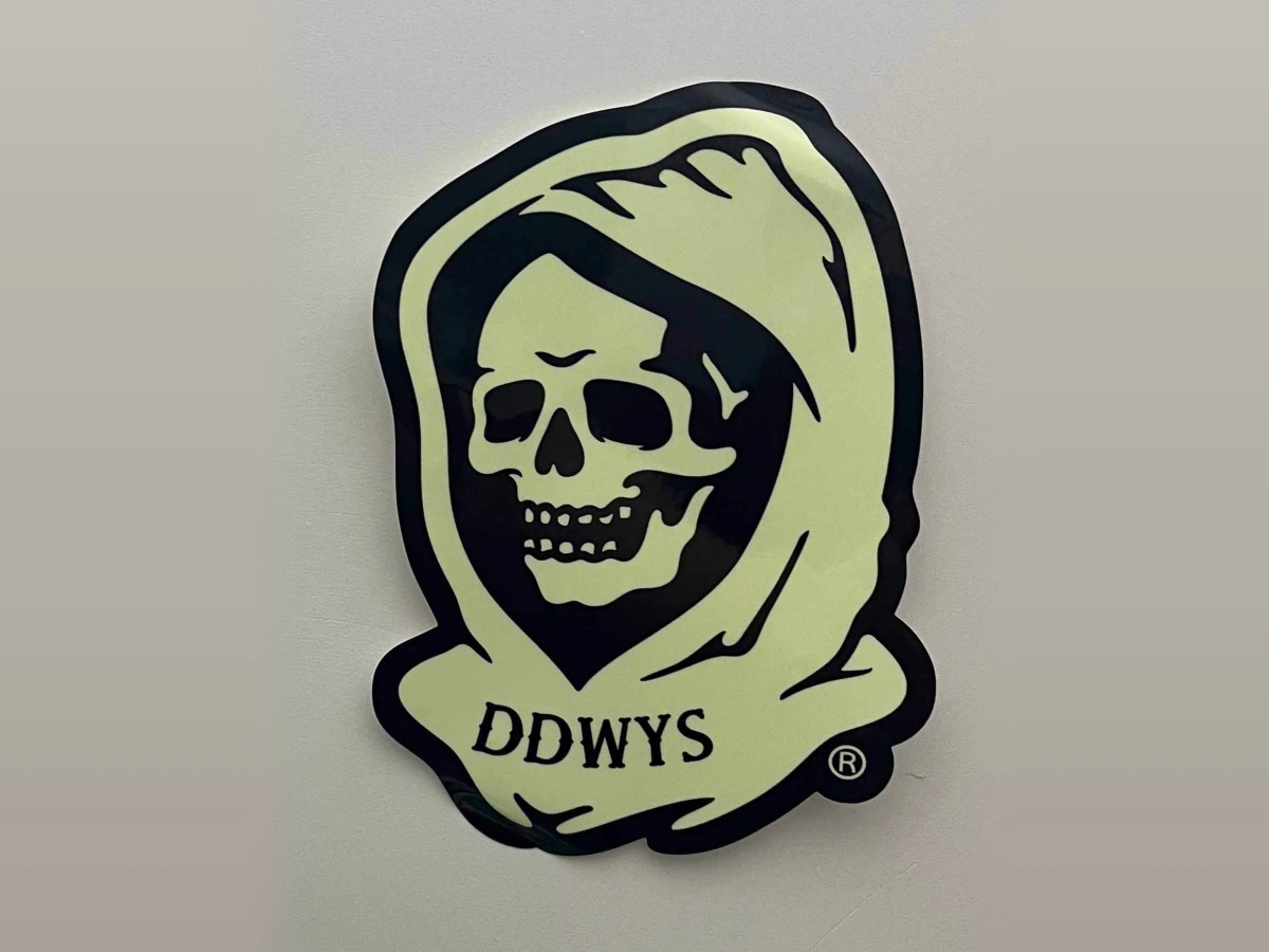 Custom die-cut glow-in-the-dark sticker appearance in normal daylight