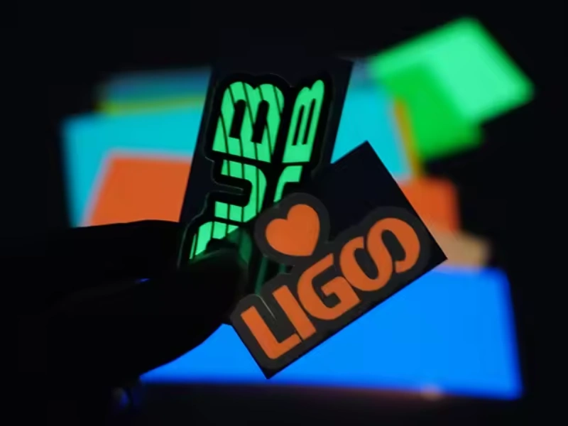 Custom kiss-cut glow-in-the-dark stickers on easy-peel rectangular backing