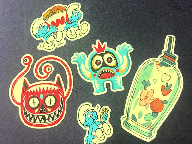 Full-color custom printed glow-in-the-dark stickers shown in normal daylight